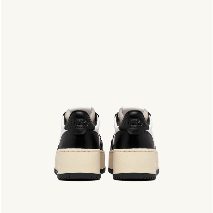 AUTRY MEDALIST PLATFORM SNEAKERS IN WHITE AND BLACK LEATHER