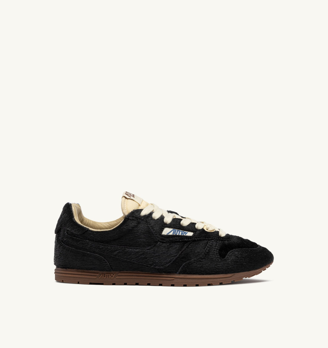AUTRY WINDSPIN SNEAKERS IN BLACK PONY SUEDE