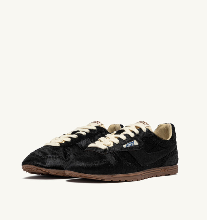 AUTRY WINDSPIN SNEAKERS IN BLACK PONY SUEDE
