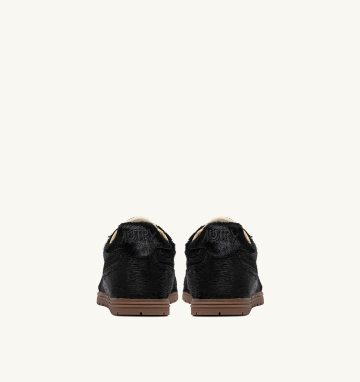AUTRY WINDSPIN SNEAKERS IN BLACK PONY SUEDE
