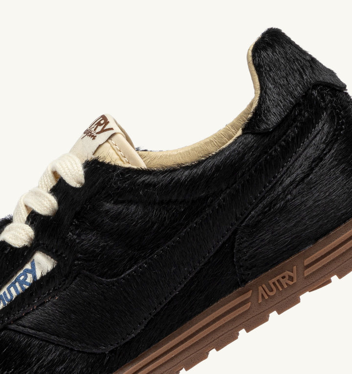 AUTRY WINDSPIN SNEAKERS IN BLACK PONY SUEDE
